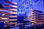 Olson Kundig Architects stacked and staggered glu-lam beams into a handsome, comfortable lounge for Design Miami. The chandelier is by Lilienthal | Zamora.<br /><div id='_mcePaste'>﻿﻿