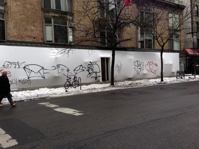 The facade for the <em>BLUEPRINT</em> exhibition was tagged with graffiti soon after it opened.<div id='_mcePaste'>