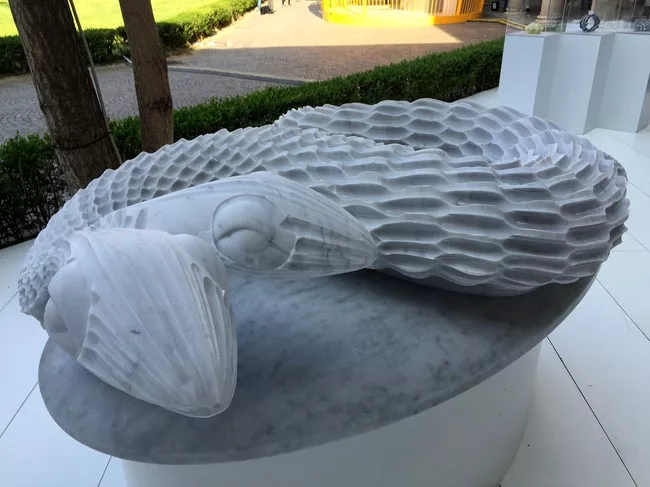 Raffaello Galiotto used a numerical control cutter with a spherical tool to shape Carrara marble into a two-headed serpent.
