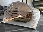 Based on the <em>Irori</em>, a traditional Japanese sunken hearth, Kuma's installation features a fire pit beside a cooking and dining area.