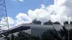 The facility includes a 9-acre rooftop park, barely visible from the ground.