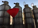 Lighting manufacturer Viabizzuno displayed light installations inside large silos in a Milan courtyard.