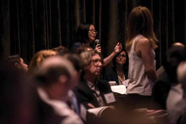 An attendee participates in a q&a session. <br />
