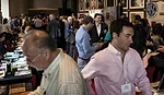Attendees visit the exhibitors hall between sessions.