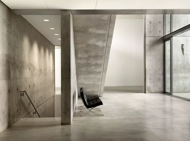 The new below-grade galleries are accessed by a stair that descend from the building’s water court entry.