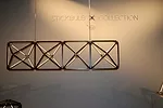 Modular chandeliers comprised of brass, wood, and LEDs are part of Long Island City-based RUX’s new Stickbulb X Collection.<div id='_mcePaste'>﻿﻿