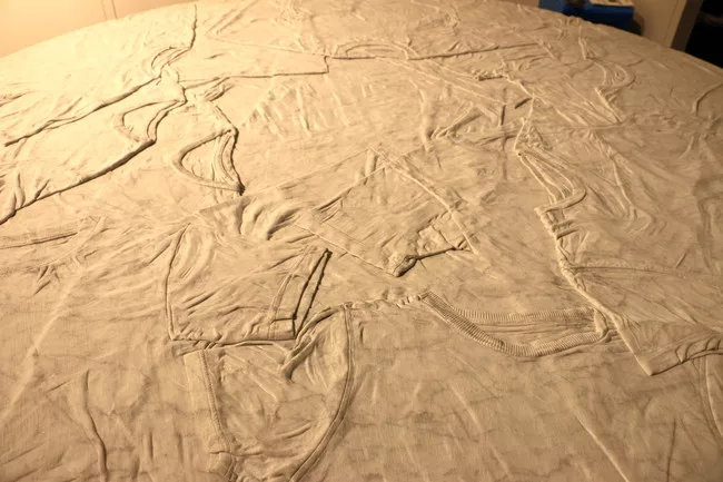 Casa Canova’s marble tables, designed by Sean Knibb in California and carved by hand in Italy, look like incredibly realistic piles of jeans and t-shirts.<div id='_mcePaste'>