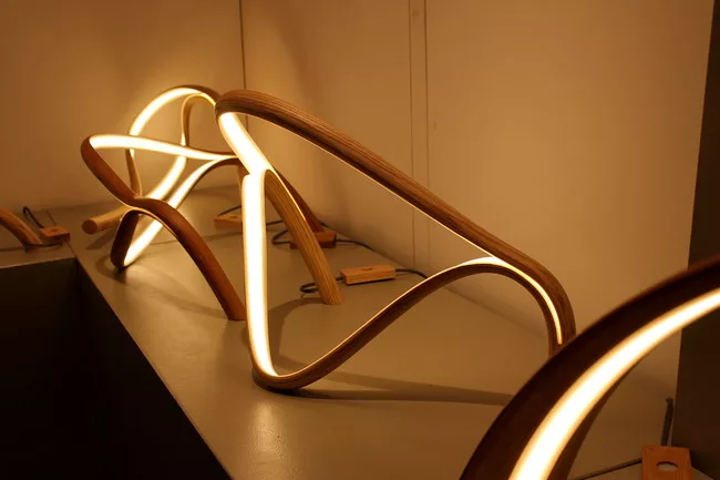 Sculptor and woodworker John Procario creates sculptural LED lamps out of bent wood.<div id='_mcePaste'>