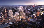 As shown in this architectural model, two towers, on the east and west ends of the site, will contain apartments and condominiums, while two buildings facing Sunset Boulevard will contain restaurants,