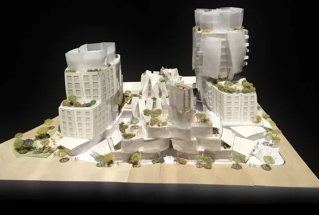 As shown in this architectural model, two towers, on the east and west ends of the site, will contain apartments and condominiums, while two buildings facing Sunset Boulevard will contain restaurants,