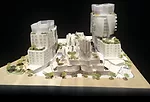 As shown in this architectural model, two towers, on the east and west ends of the site, will contain apartments and condominiums, while two buildings facing Sunset Boulevard will contain restaurants,