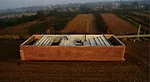 RUF wrapped this prototype house in Shinjia, China with a brick screen.