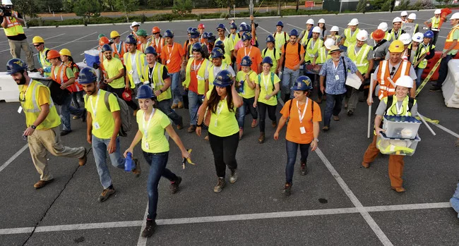 2015 Solar Decathlon participants arrive on the building site.
