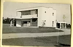 Denise Scott Brown in front of her family home.
