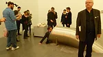 A visitor wears a pair of H'ller's vision-inverting prism goggles, while another climbs into <em>Untitled (Slide)</em>, 2011