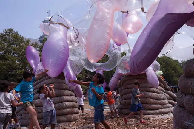 <em>Burble Bup</em>, a pavilion on New York City's Governor's Island in summer 2011, consisted of a roof of inflatable, doughnut-shaped 'Bups' lashed together with harnesses, supported by bark-filled 