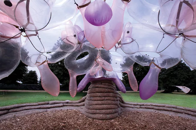 <em>Burble Bup</em>, a pavilion on New York City's Governor's Island in summer 2011, consisted of a roof of inflatable, doughnut-shaped 'Bups' lashed together with harnesses, supported by bark-filled 