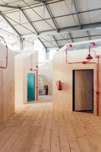 For the Red Bull Music Academy, the abstract and figurative paintings of Philip Guston helped inspire the whimsical gathering of house-like rehearsal rooms along a raised walkway.