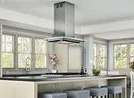 The Verona Island range hood by Zephyr Ventilation features a sleek glass-plane canopy with built-in LEDs that can change from white to blue or amber to suit both the kitchen design and the co