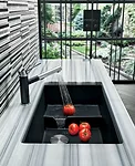 A happy medium between the aesthetic of a wide designer bowl and the functionality of a double-sink, Blanco's Precis Cascade is a minimalist undermount fixture that features a tiered design to create 