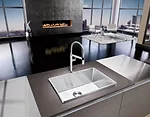 The antithesis of the discreet undermount sink, Blanco's Attika makes a bold design statement with its elevated, geometric rim, while also helping to reduce excess splashing onto adjacent work surface