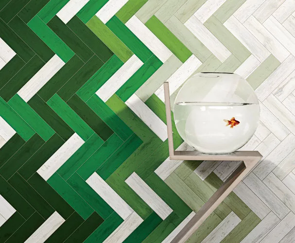 As many tile companies have been doing in recent years, new Italian brand 41zero42 draws on wood flooring for its porcelain series U-Color, but saturates the faux-bois pieces with vibrant color using