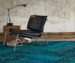 Mohawk Group's New Vintage Collection is a plank-style carpet series that uses neutral or saturated monochromatic palettes to reproduce antique rug patterns, mimicking worn surfaces where traces of th