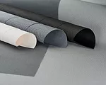 These new roller-shade textiles from MechoSystems are woven  of a polyvinyl-PVC blend in a  2” x 2” basketweave, resulting in  a soft hand, smooth texture,  and optimal solar-shading and g