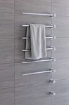 Like all other Vola fixtures, the T39EL Towel Warmer is minimalist and sculptural in design. It consists of three to 20 bars that can be spaced 4” to 12” apart on the wall, has an auto-shu