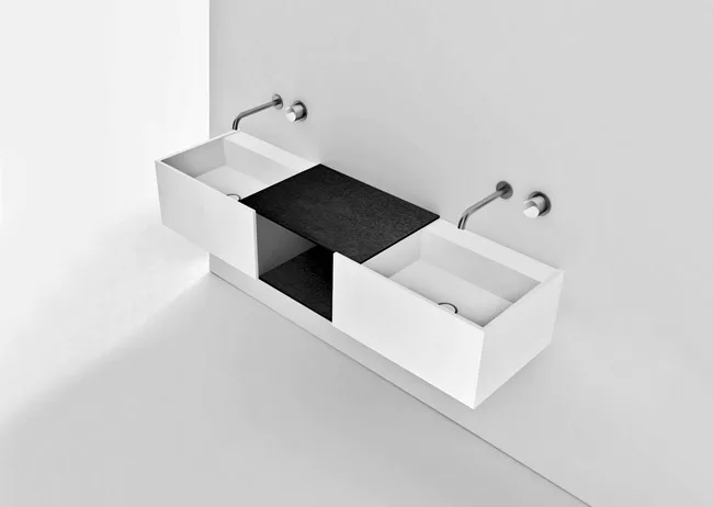 A streamlined washbasin and storage combination, DueC was designed  for Boffi by architect Victor Vasilev. The double-sink version positions an open shelf between the basins, while the single can be s