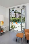 The slim stile and rail profiles—from 2¾” to 3⅝”—of LaCantina's Swing Doors allow for larger open areas that bring in more natural light and outdoor views. To meet d
