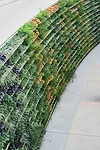 Biophilia suggests that nature can aid the healing process, so vertical gardens are gaining ground in health-care design. To that end, this 1,400-square-foot living wall stands in  an outdoor space of