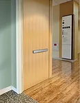 This wood door can be fitted with an inset panic device for use within fast-paced, high-traffic environments such as hospital facilities, though lever hardware is also available. Other specification o