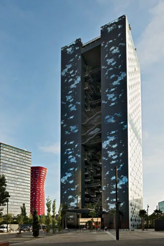 Nouvel extended the oasis theme to the facades, with patterns of sky and shade on the north face and palm-tree cutouts for guest-room windows.The silkscreened curtain wall becomes transparent 