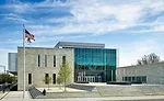 The high school’s main entrance at the northeast corner is elevated on a plinth, which is intended to give the school a sense of importance as well as to provide sitting areas on the steps.