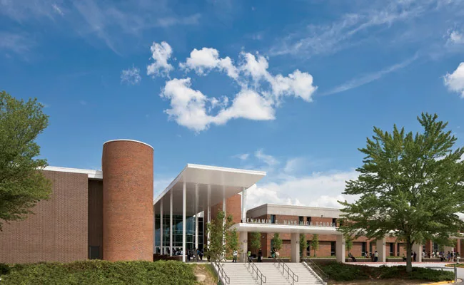 A double-height canopy marks Mays's new and improved entrance.
