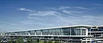 The Sheraton stretches along the entire length of the airport terminal, so that its elongated west facade is what drivers see from the road.