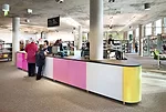 Enamel panels set flush in the library's reception counter provide colorful accents to the interior.