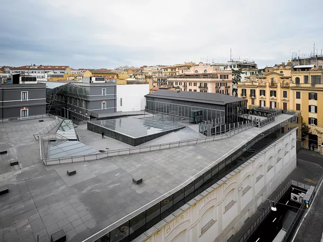 The architects created an artificial landscape on the museum's roof, placing a piazza there to connect the building to its historic context. The large skylight in the center of the piazza was designed