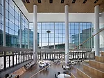 The atrium serves multiple functions, from eating or socializing to presentations for several hundred people.