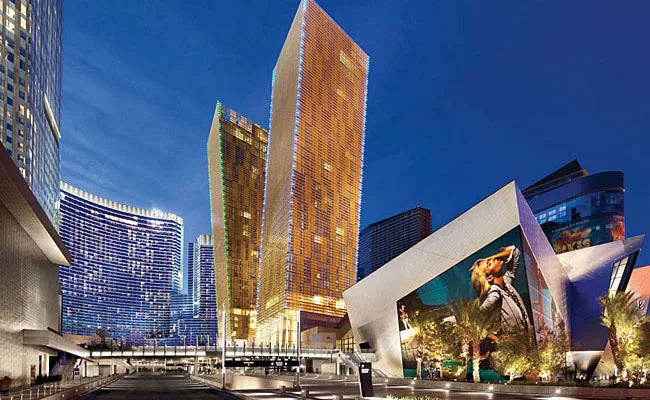 The tilt of the Veer condominium towers (center of photo) is emphasized by LED fixtures mounted on the corner of the buildings' shading devices. To ensure the longevity of LEDs in the hot desert clima