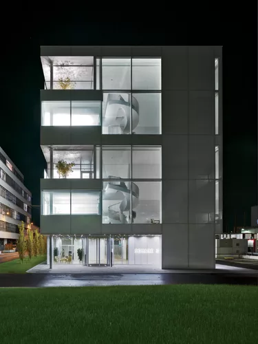 Luminous in its simplicity and materiality, the building radiates a gentle glow from within. There are no outdoor lighting fixtures directed at the glazed structure, and the light inside, generated fr