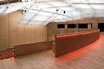 Below grade, a 600-seat auditorium can be divided into two sections. It features: a wood-lined acoustical wall perforated with a subtle graphic pattern by the New York'based graphic design firm 2x4; a