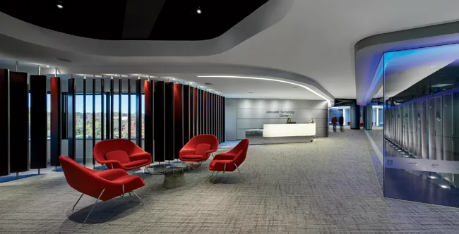 Upon entering the lobby of the Southfield MTC, visitors are immediately drawn to the luminous solid-surfacing reception desk, lit with LEDs. Wooden louvers allow daylight in or block it out, as needed