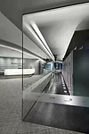 The Server Display Center showcases Microsoft's powerful technology. SmithGroup worked hard to make it visible, setting it aglow with LEDs tucked into a cove in the ceiling. A translucent film with di