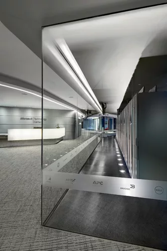 The Server Display Center showcases Microsoft's powerful technology. SmithGroup worked hard to make it visible, setting it aglow with LEDs tucked into a cove in the ceiling. A translucent film with di