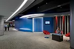 SmithGroup outlined the portal to the Envisioning Center&mdash;an auditorium-like space&mdash;with LEDs behind a translucent acrylic. A ribbon of the undulating blue wall bows in and out to mimic the 