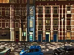 Shadow play Custom fixtures at the tops of the poles (Slide 3) face away from the street and house a series of mirrors and projectors that distribute a playful array of vertical and horizontal light p