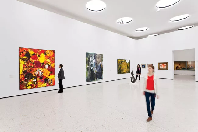 The skylights provide even illumination for temporary modular displays (right).