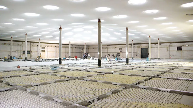 Inside: Twelve slender columns support the roof structure; The geothermal HVAC system includes in-floor heating.